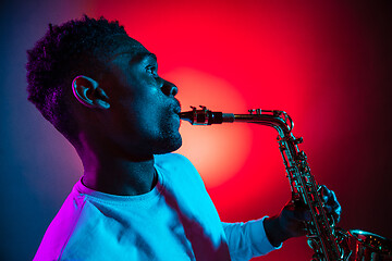 Image showing African American jazz musician playing the saxophone.