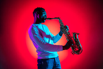 Image showing African American jazz musician playing the saxophone.