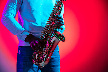 Image showing African American jazz musician playing the saxophone.