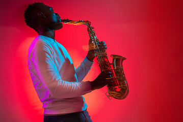 Image showing African American jazz musician playing the saxophone.