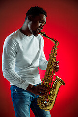 Image showing African American jazz musician playing the saxophone.