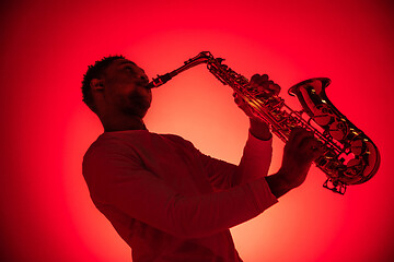 Image showing African American jazz musician playing the saxophone.