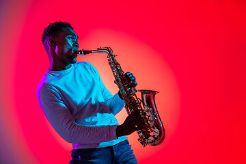 Image showing African American jazz musician playing the saxophone.