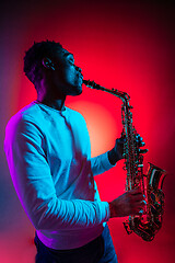 Image showing African American jazz musician playing the saxophone.