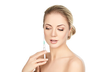 Image showing beautiful girl holding syringe isolated on white