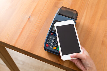 Image showing Cellphone pay on pos machine