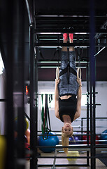 Image showing woman working out on gymnastic rings