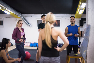 Image showing athletes getting instructions from trainer