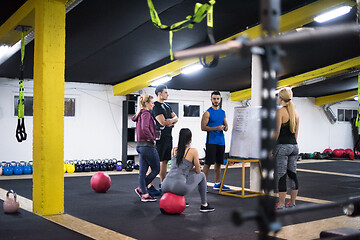 Image showing athletes getting instructions from trainer