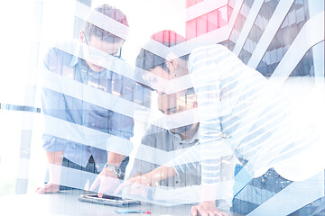 Image showing group of Business People Working With Tablet in startup office