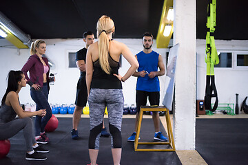 Image showing athletes getting instructions from trainer