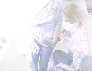 Image showing Pretty Businesswomen Using Tablet In Office Building during conf