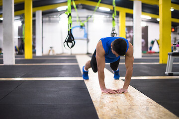 Image showing Young  man doing pushups