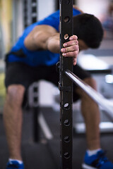 Image showing man doing pull ups on the vertical bar