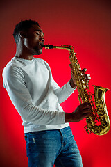 Image showing African American jazz musician playing the saxophone.