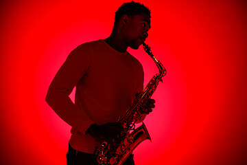 Image showing African American jazz musician playing the saxophone.