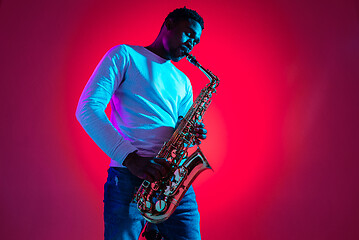 Image showing African American jazz musician playing the saxophone.