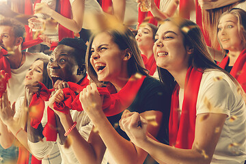 Image showing Group of happy fans are cheering for their team victory.