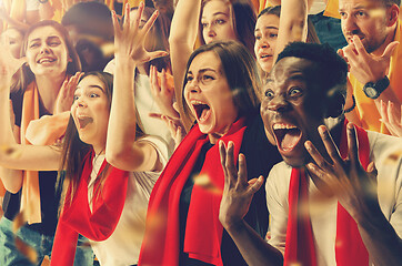 Image showing Group of happy fans are cheering for their team victory.