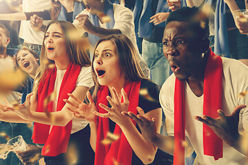 Image showing Group of happy fans are cheering for their team victory.