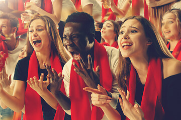 Image showing Group of happy fans are cheering for their team victory.