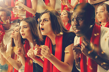 Image showing Group of happy fans are cheering for their team victory.