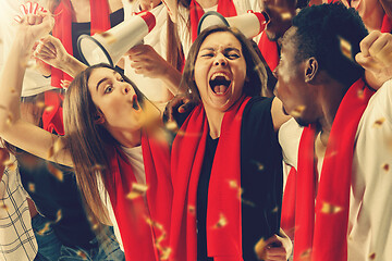 Image showing Group of happy fans are cheering for their team victory.