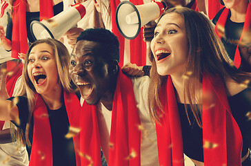 Image showing Group of happy fans are cheering for their team victory.