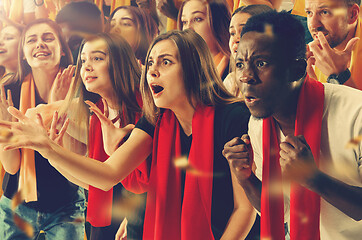 Image showing Group of happy fans are cheering for their team victory.