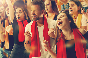 Image showing Group of happy fans are cheering for their team victory.