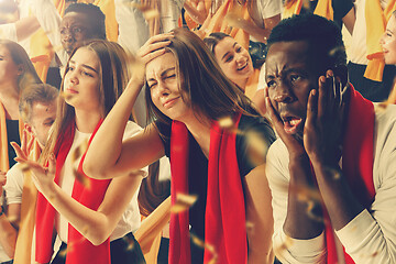 Image showing Group of happy fans are cheering for their team victory.