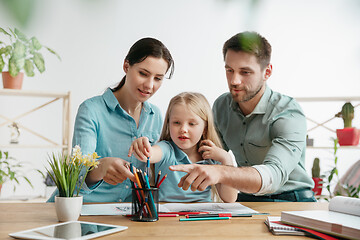 Image showing Young happy family are spending time together. A day in lovely home.