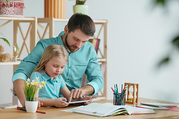 Image showing Young happy family are spending time together. A day with loved ones at home.