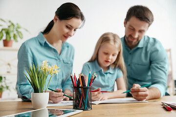 Image showing Young happy family are spending time together. A day in lovely home.