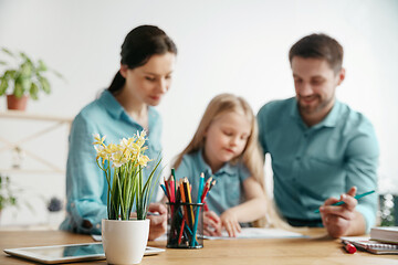 Image showing Young happy family are spending time together. A day in lovely home.