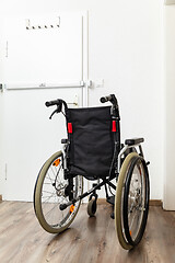 Image showing Wheelchair at an apartment door