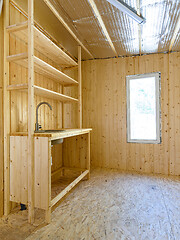 Image showing Construction of a country house. Installed homemade yet stylish wood kitchen