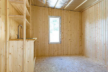 Image showing Interior of a new wooden kitchen in a country house