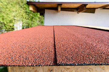 Image showing For the roof, a red roll flexible bituminous tile was used