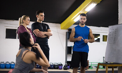 Image showing athletes getting instructions from trainer