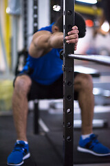 Image showing man doing pull ups on the vertical bar