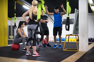 Image showing athletes getting instructions from trainer