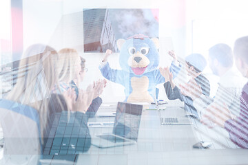 Image showing boss dresed as bear having fun with business people in trendy of