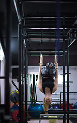 Image showing woman working out on gymnastic rings