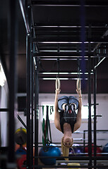 Image showing woman working out on gymnastic rings
