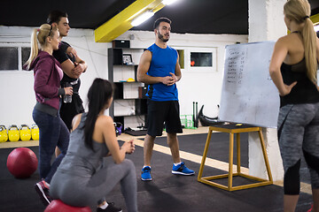 Image showing athletes getting instructions from trainer