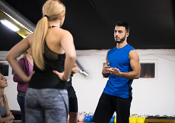 Image showing athletes getting instructions from trainer