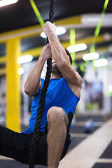 Image showing man doing rope climbing