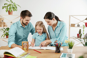 Image showing Young happy family are spending time together. A day in lovely home.