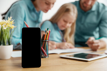 Image showing Young happy family are spending time together. A day with loved ones at home.